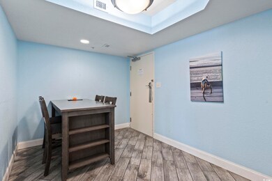 Dining area with hardwood / wood-style flooring