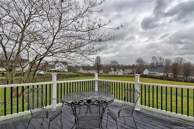 Large deck with vinyl railing overlooks your HUGE backyard!