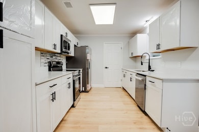 Renovated kitchen with window to view backyard and