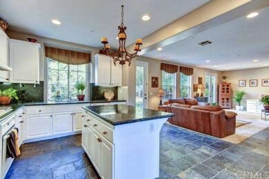 Granite Kitchen opens up to Super size Family Room