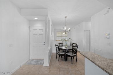 Dining area featuring light tile patterned floors,