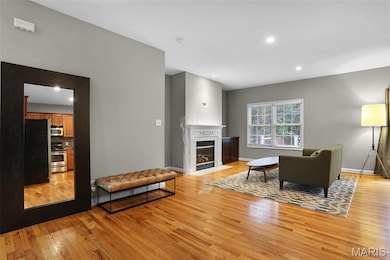 Foyer leads into the large family room complete with gleaming hardwoods, taller ceilings and lots of recessed lights