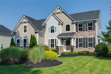 Craftsman-style home with a front yard