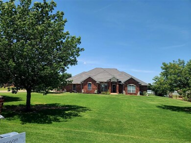 Single story home with a front yard and brick siding