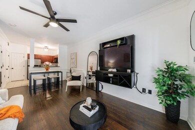 Living room with wood-type flooring, ornamental mo