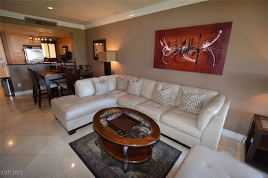 Living room featuring ornamental molding, visible