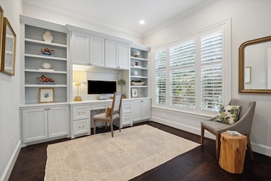 Study with engineered wood floors, recessed lighti