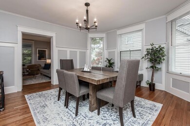 Spacious dining room calls for everyday entertaining with incredible features, lovely light fixture and huge windows that bring in tons of natural light.