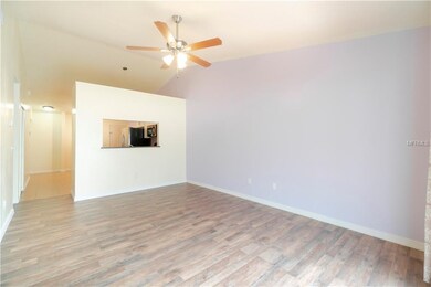 Kitchen pass through overlooks the family room