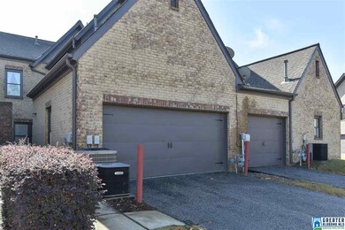 This townhome has a 2-car garage with an alley ent