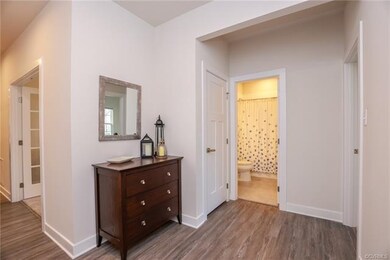 The Foyer leads into a secondary bedroom and full 