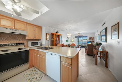 All Tile Flooring, Breakfast Bar, Pantry, Wood Cabinets