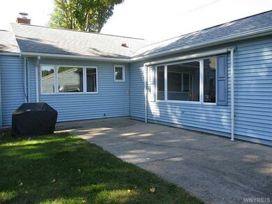 Exterior Back. Note: Roll down awning & natural ga