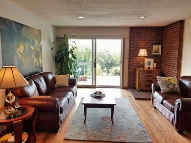 Wood flooring in the living room shines from the n