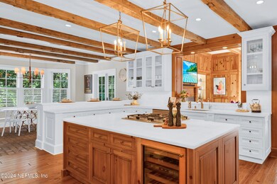 Gourmet kitchen with relaimed wood beams