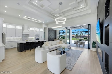 Living room featuring a towering ceiling, light wo