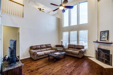 Spacious light filled living room with giant windows overlooking the saltwater pool
