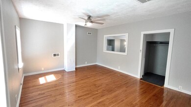 living room with hardwood flooring, new ceiling fa