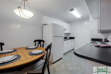 Dining nook and galley kitchen.