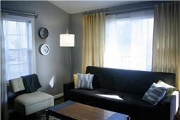 FAMILY ROOM WITH VAULTED CEILING, REAL HARDWOOD FLOORS, AND BIG WINDOWS FOR LOTS OF NATURAL LIGHT!