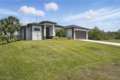 Prairie-style house with concrete driveway, an att
