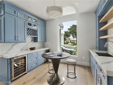 Indoor dry bar with beverage cooler, tasteful back