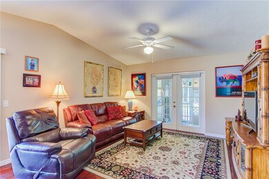 High Ceiling Living Room with French Doors to Lanai