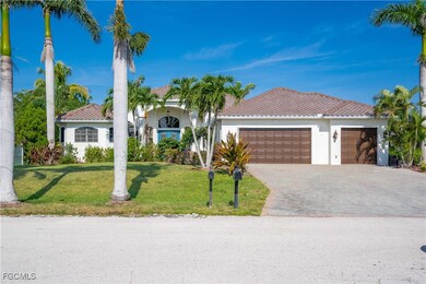 View of front of house featuring stucco siding, a tiled roof, decorative driveway, a front lawn, and a garage