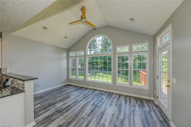Spacious morning room features a vaulted ceiling, 