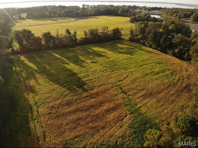 Aerial overview of property's location featuring a nearby body of water and rural landscape