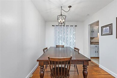 Dining room with patio doors leads to deck with fe