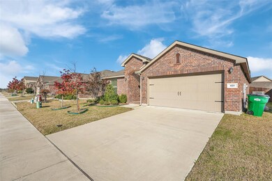 View of front of house with a garage and a front lawn