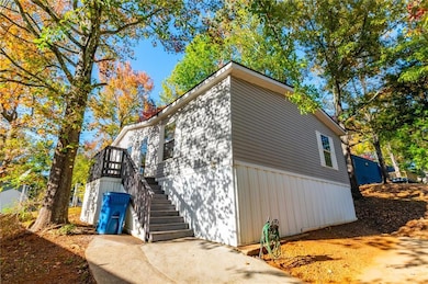View of home's exterior with stairs and porch entr