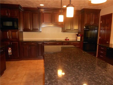 VIEW OF KITCHEN W/ELECTRIC COOK TOP & DOUBLE WALL 