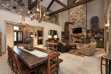 30 FT STONE FIREPLACE WITH HEARTH! WALL OF FRENCH DOORS THAT LEAD TO PATIO AREA! GREAT FRO ENTERTAINING!