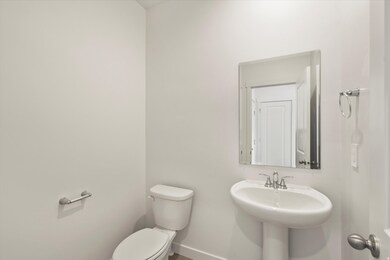 Bathroom featuring toilet and baseboards