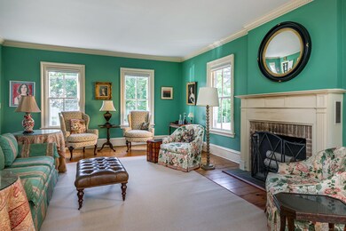 A fireplace centers the seating area.