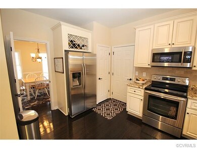 Modern Kitchen w/ custom built-ins, wine rack, ss 