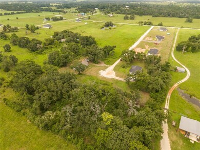 Aerial view of property's location featuring rural