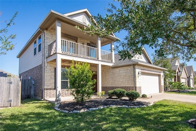 Great Curb Appel with brick and stone elevation and front porch with second story balcony