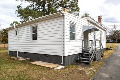 View of property exterior featuring crawl space, a