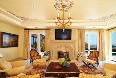 Formal living room complete with pool and ocean vi