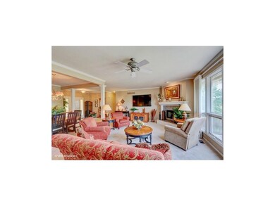 Open floor plan: living room with bank of windows