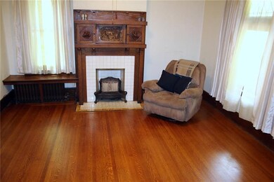 Living room, intricately carved mantel original to