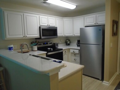 Kitchen featuring appliances with stainless steel 