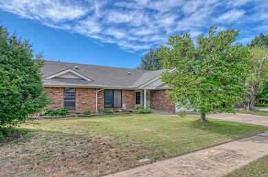 View of front facade with a garage and a front law