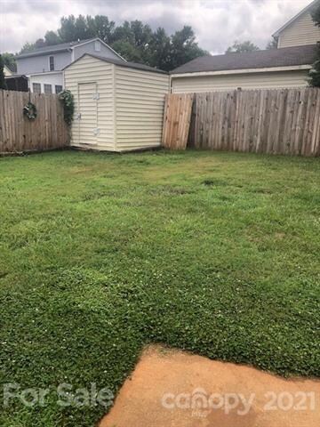 Lovely back yard with storage shed and privacy fen