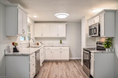 Updated kitchen with stainless steel appliances.