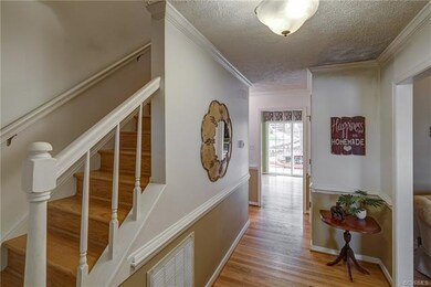 Hardwood, Crown Molding and Chair Rail in Foyer