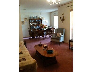 Exterior Front. Formal dining room and den